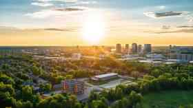 Panoramic view of urban space with lots of trees.
