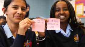 Students show post-it notes of their green plans.