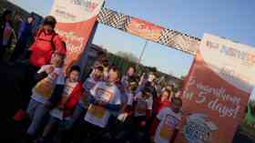 Karen Robinson running the finish line