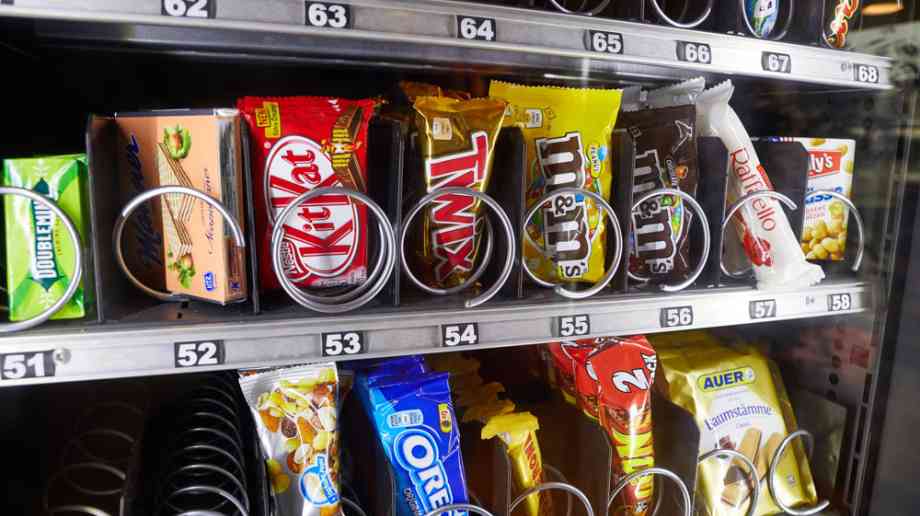 Vending machine with confectionary inside