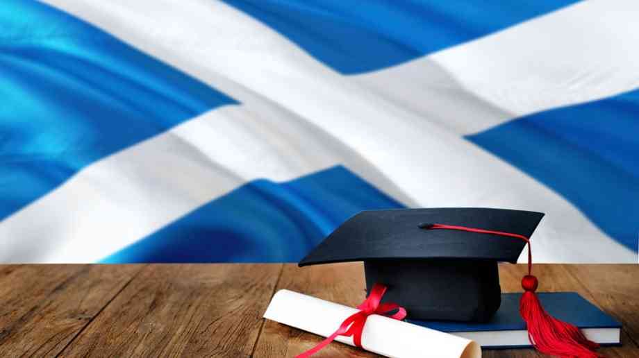 Graduate cap and Scottish flag.