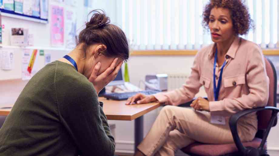 Two stressed teachers talk together