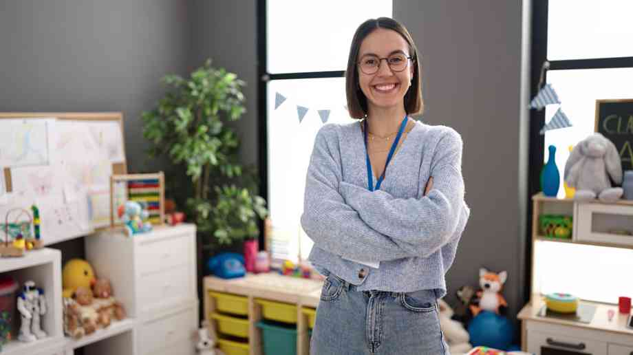 Young teacher smiling in classroom