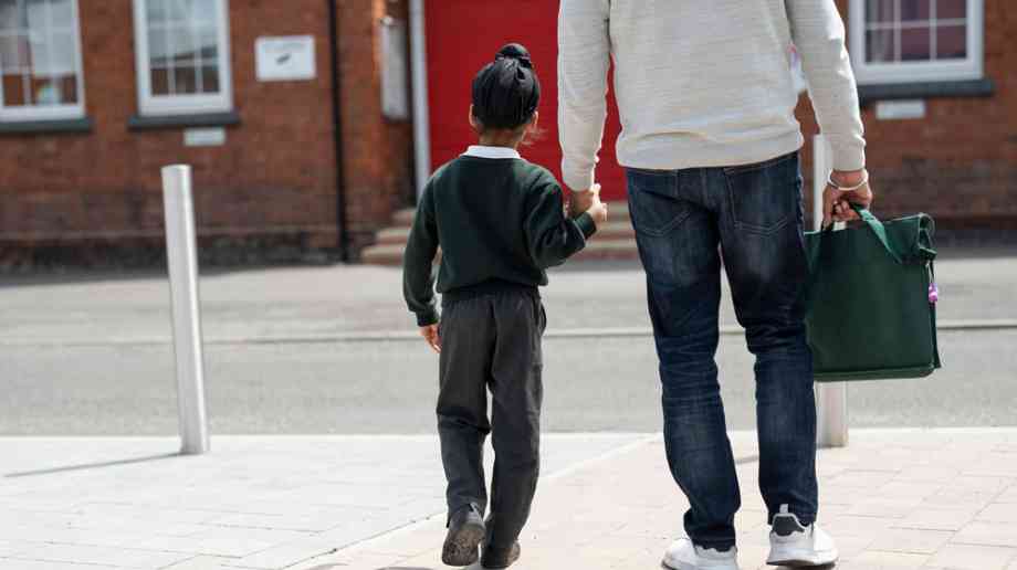 Father taking his child to school.