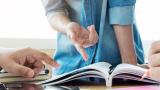Teacher with book